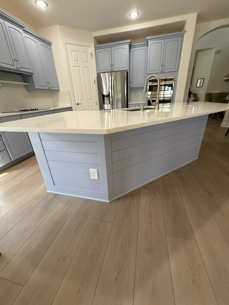 Bright white custom kitchen with an island by Premier Magnolia Homes