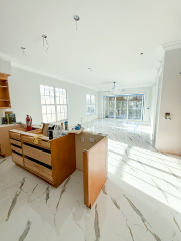 Open-concept great room and kitchen by Premier Magnolia Homes