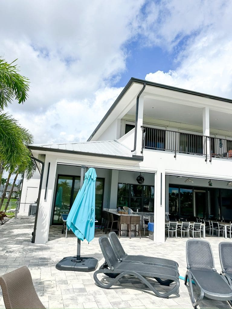 Waterfront custom home with a pool and lanai by Premier Magnolia Homes