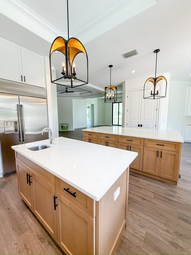 Open kitchen with a wood island, looking through to the living space