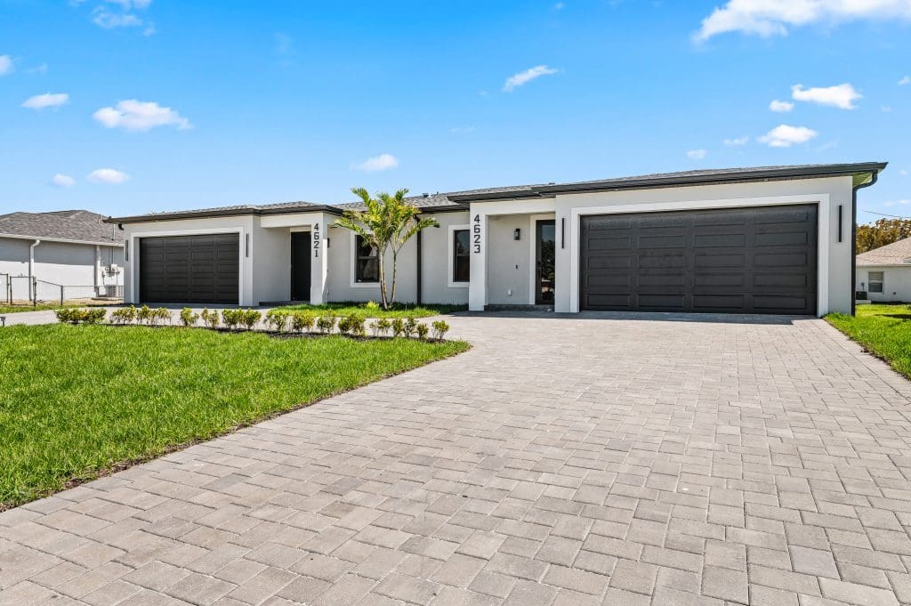 Custom Southwest Florida home with a paver driveway by Premier Magnolia Homes