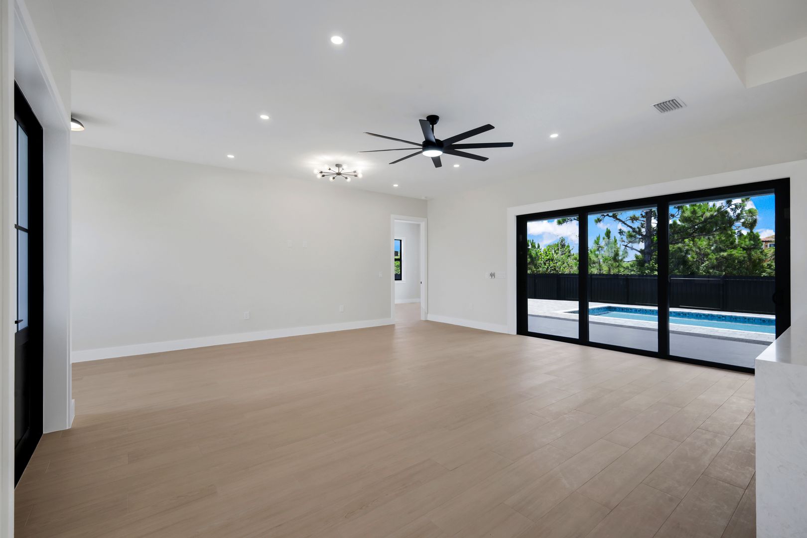 Oikos great room with pool view