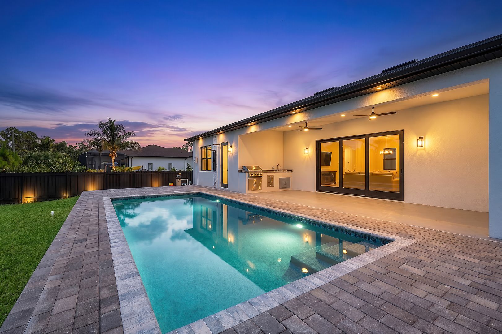 Pool and covered lanai at dusk