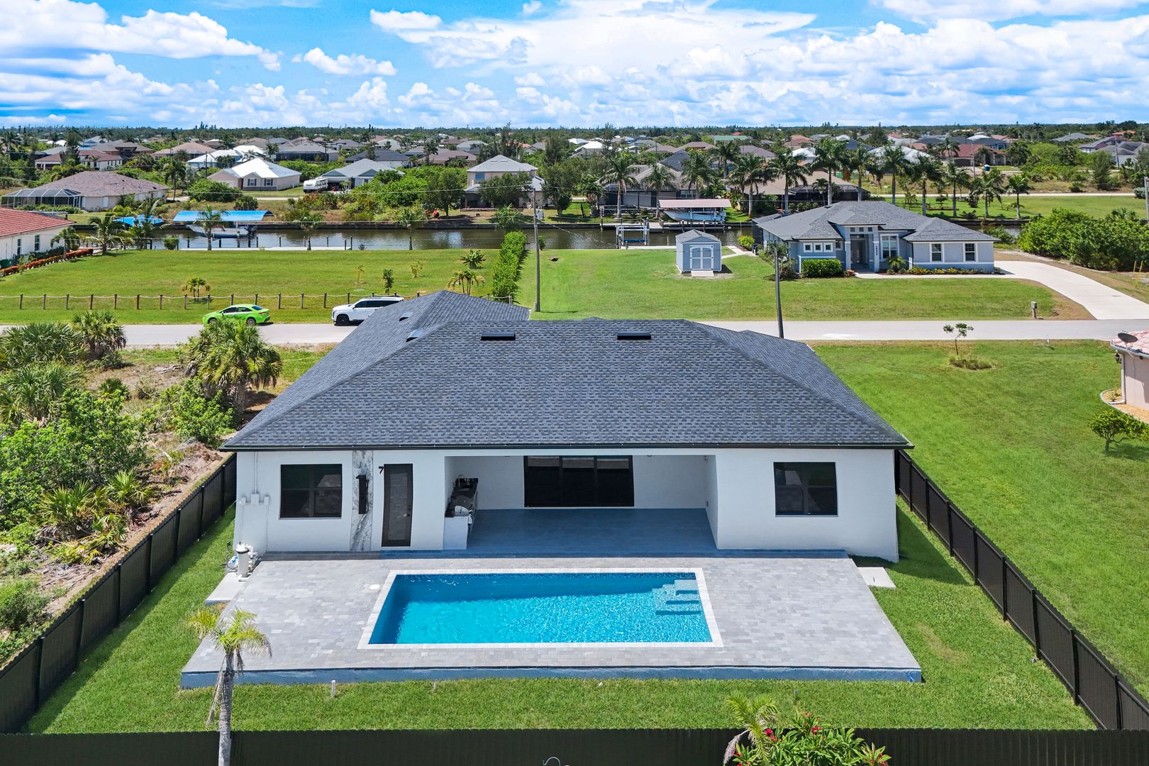 Aerial of the back of the home and pool