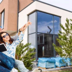 happy-homeowners-outside-home